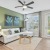 Jacksonville apartment living room featuring a sage green accent wall, chic furnishings, and access to an outdoor patio