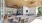 Covered lanai with fireplace, TV, and various seating areas at Bainbridge Avenues Walk in Jacksonville, FL