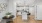 open-concept apartment in Jacksonville with luxury plank flooring and a large modern kitchen plus dining area