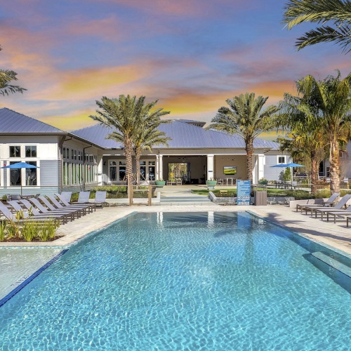 Infinity Edge Saltwater Pool Overlooking the Lake resort-style swimming pool at Bainbridge Avenues Walk in Jacksonville, FL
